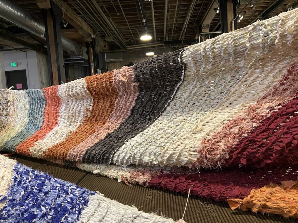 Looking up from the floor at a stretched fabric form.
