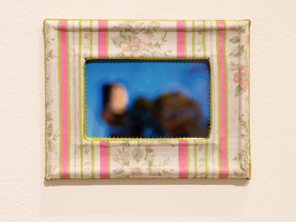 A framed photograph on a wall.