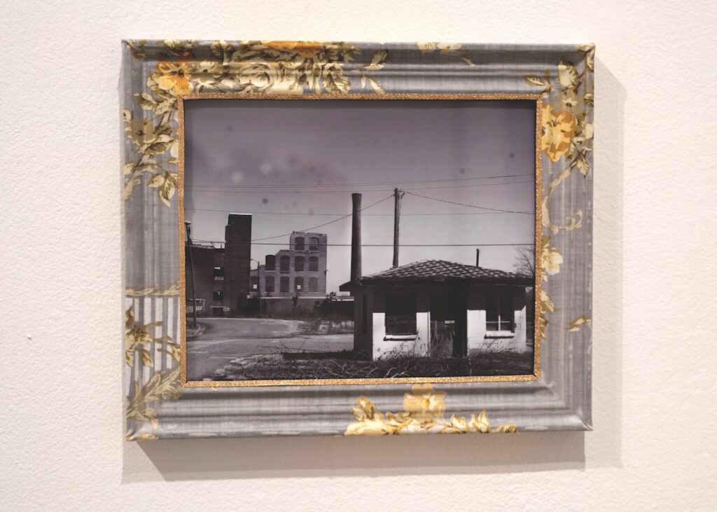 A framed photograph on a wall.