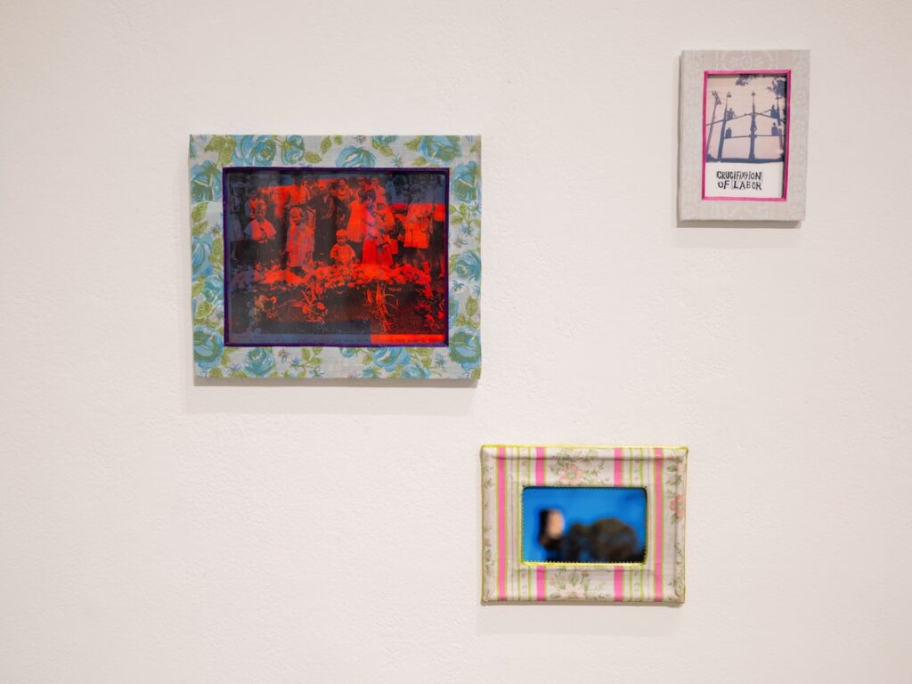 Three artworks hang on a wall.
