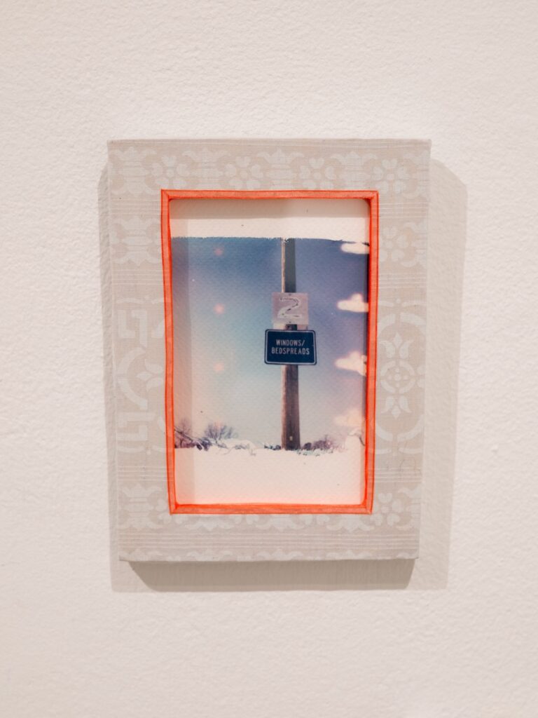 A framed photograph on a wall.